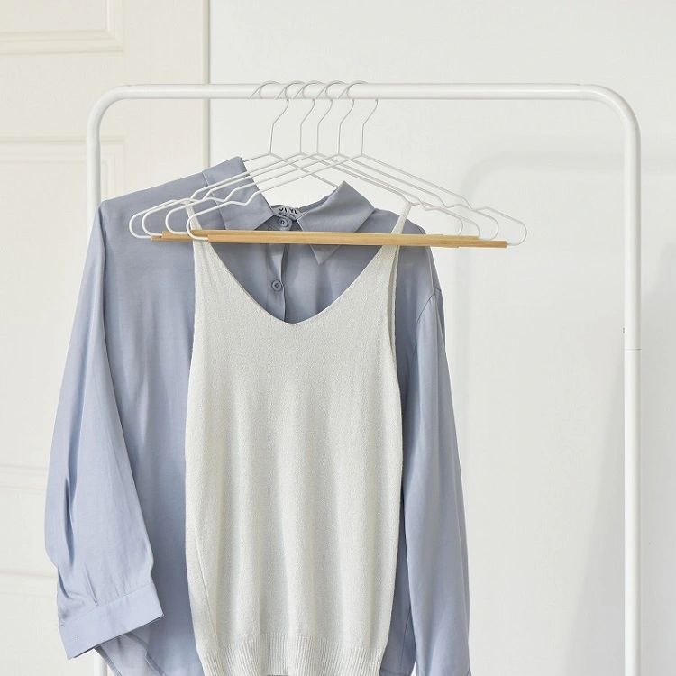 white wooden trouser hangers